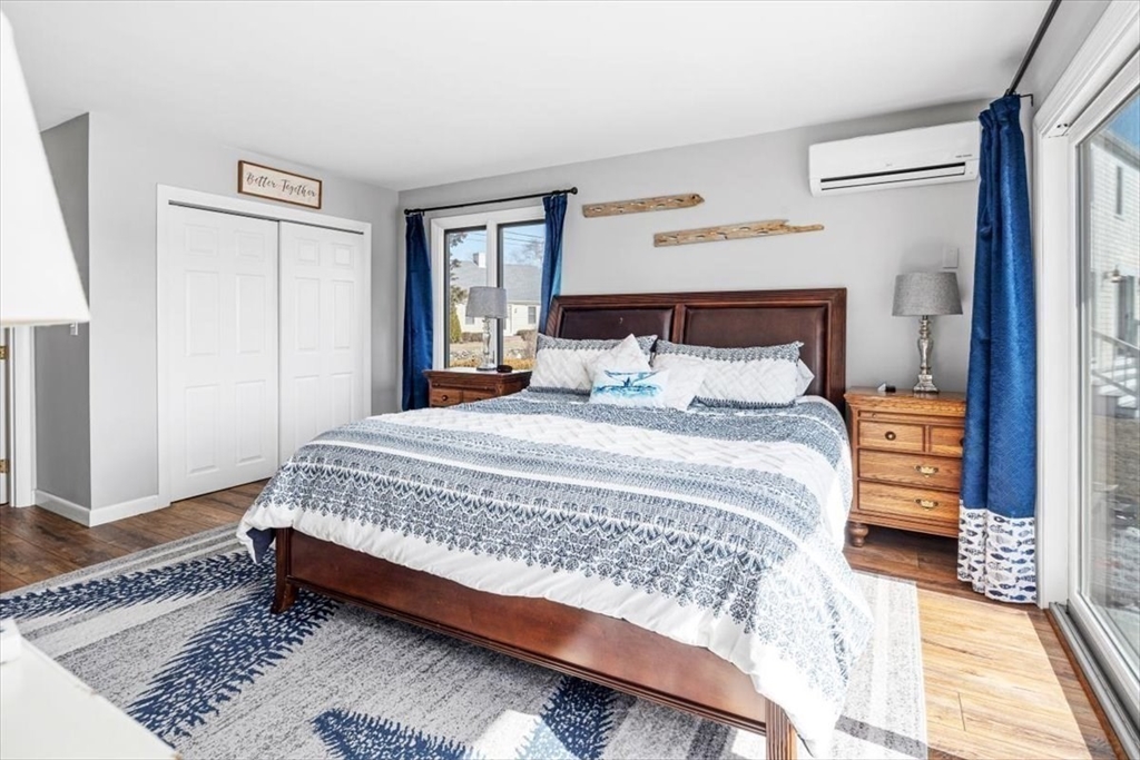 36 Benedict Road Bourne, MA 02532 - Photo 13 of 31 a bedroom with a bed and wooden floor