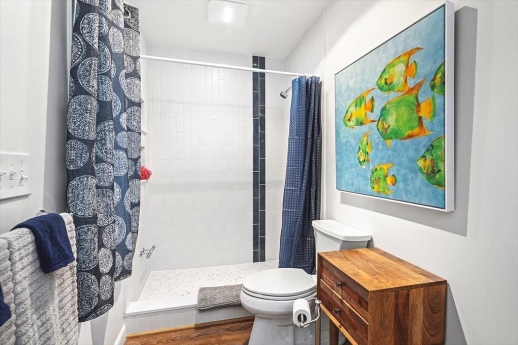 36 Benedict Road Bourne, MA 02532 - Photo 14 of 31 a bathroom with a toilet sink and shower curtain