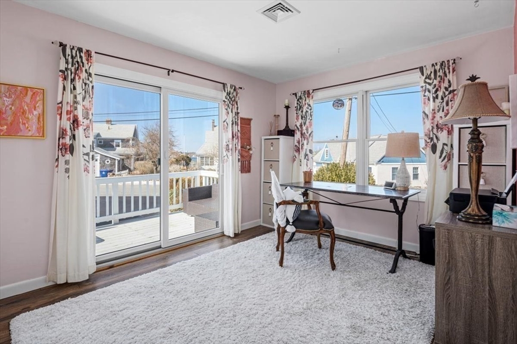 36 Benedict Road Bourne, MA 02532 - Photo 17 of 31 a living room with furniture a fireplace and a flat screen tv