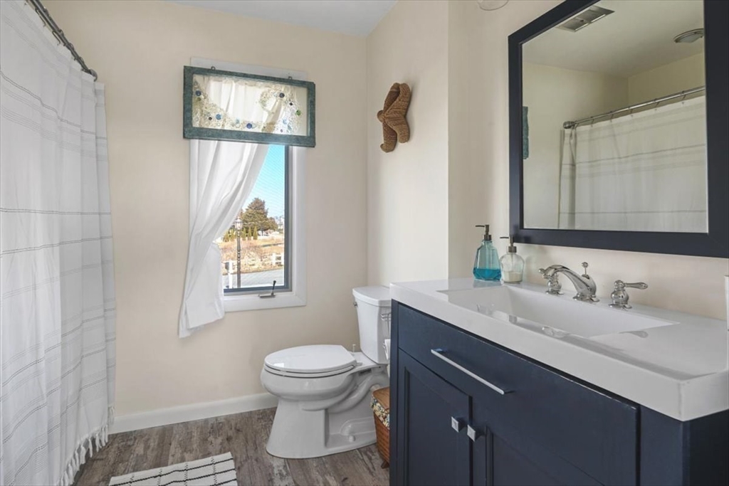 36 Benedict Road Bourne, MA 02532 - Photo 18 of 31 a bathroom with a toilet sink and mirror