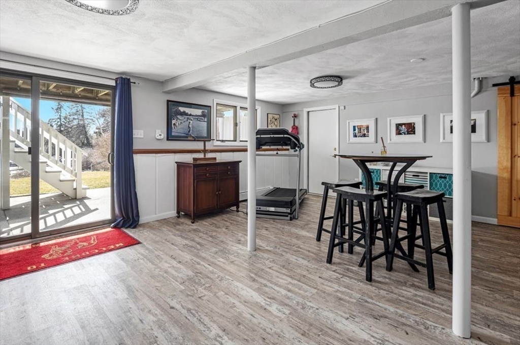 36 Benedict Road Bourne, MA 02532 - Photo 19 of 31 a view of a dining room with furniture and a floor to ceiling window