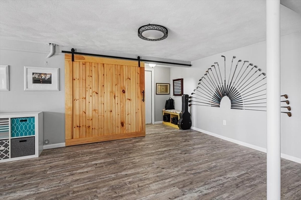 36 Benedict Road Bourne, MA 02532 - Photo 20 of 31 a view of a livingroom with furniture and wooden floor