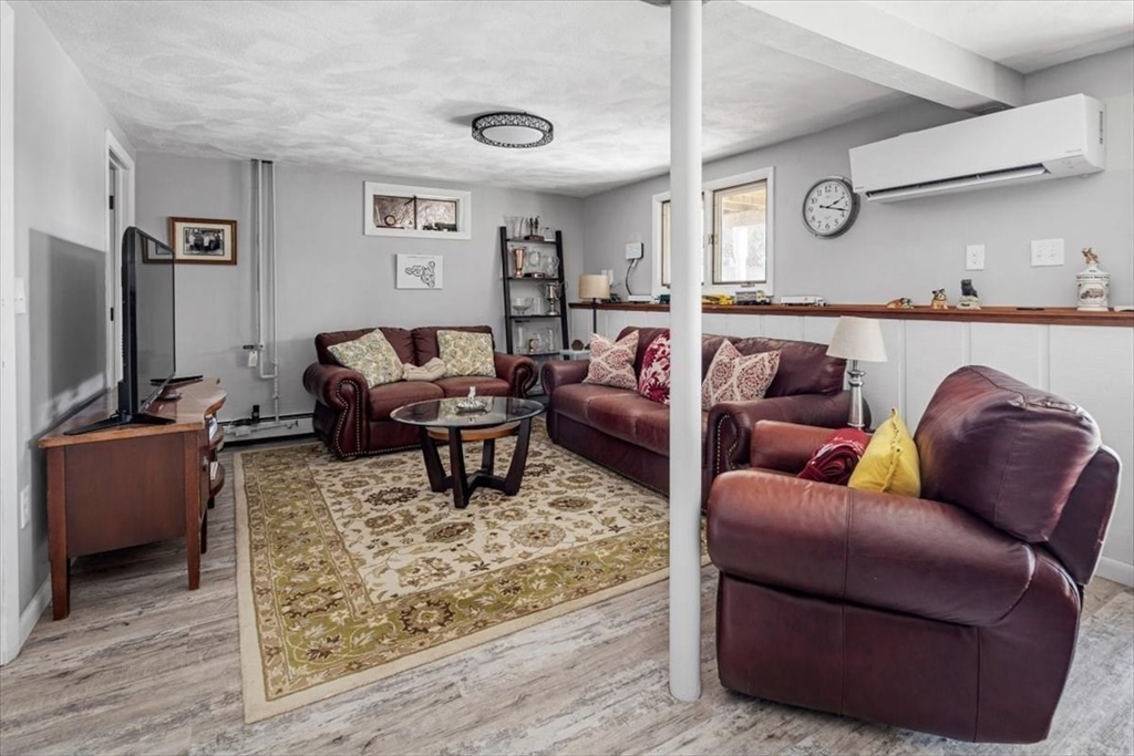 36 Benedict Road Bourne, MA 02532 - Photo 21 of 31 a living room with furniture and wooden floor