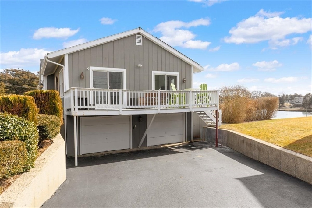 36 Benedict Road Bourne, MA 02532 - Photo 27 of 31 a front view of a house with a yard
