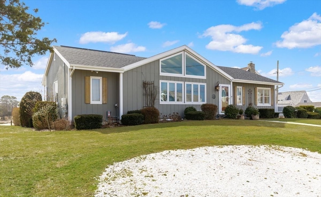 36 Benedict Road Bourne, MA 02532 - Photo 3 of 31 a view of a house with a big yard and potted plants