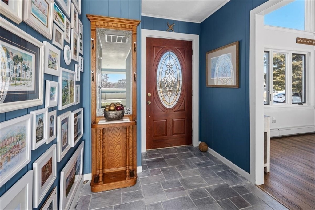 36 Benedict Road Bourne, MA 02532 - Photo 4 of 31 a view of a hallway with entryway wooden floor and front door