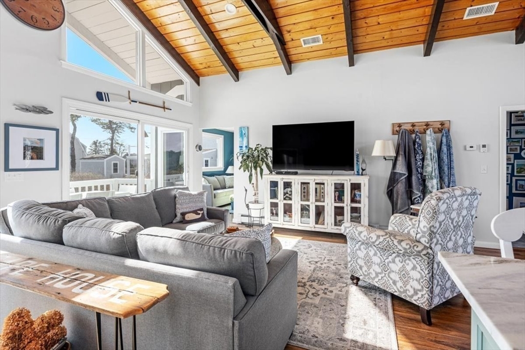 36 Benedict Road Bourne, MA 02532 - Photo 8 of 31 a living room with furniture and a flat screen tv