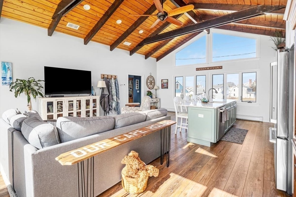 36 Benedict Road Bourne, MA 02532 - Photo 10 of 31 a living room with furniture and flat screen tv