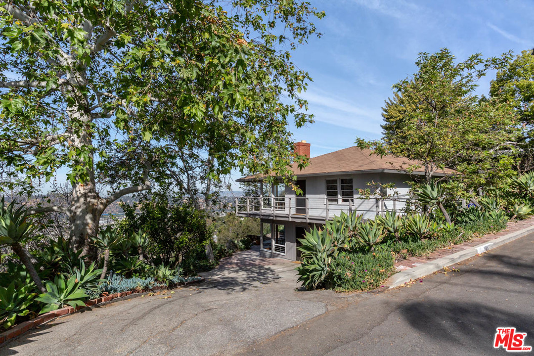 an aerial view of a house with yard and outdoor space