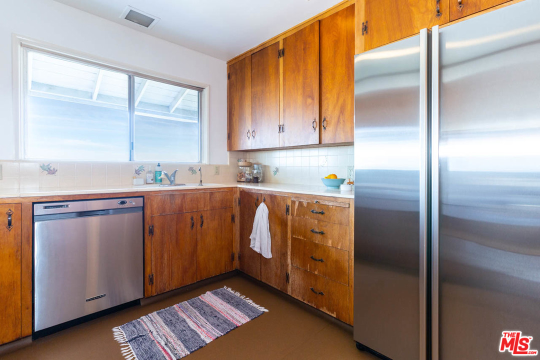 988 West Avenue 37 Los Angeles, CA 90065 - Photo 14 of 53 a kitchen with stainless steel appliances granite countertop a refrigerator and a sink