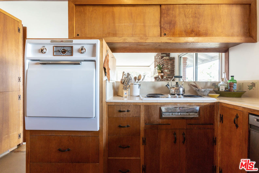 988 West Avenue 37 Los Angeles, CA 90065 - Photo 16 of 53 a kitchen with stainless steel appliances granite countertop a sink and cabinets