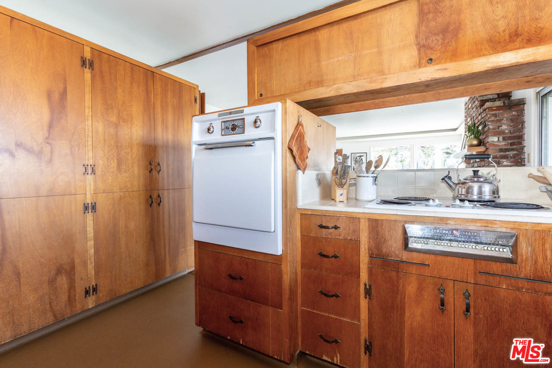 988 West Avenue 37 Los Angeles, CA 90065 - Photo 17 of 53 a kitchen with stainless steel appliances a refrigerator and cabinets