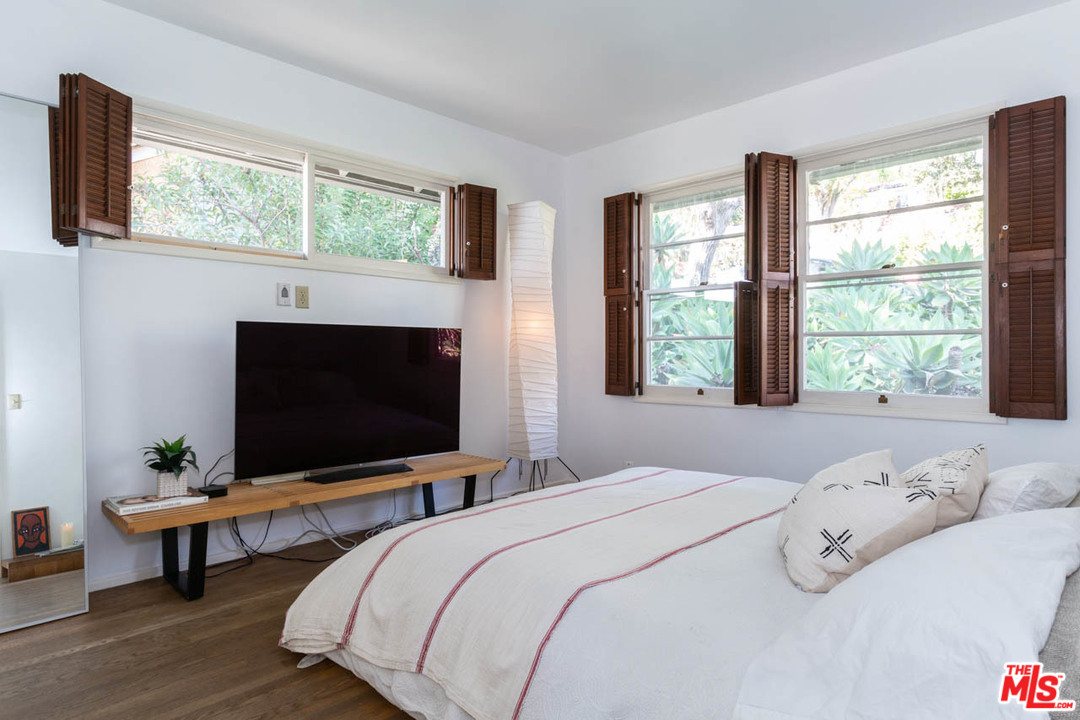 988 West Avenue 37 Los Angeles, CA 90065 - Photo 19 of 53 a bedroom with bed tv and window