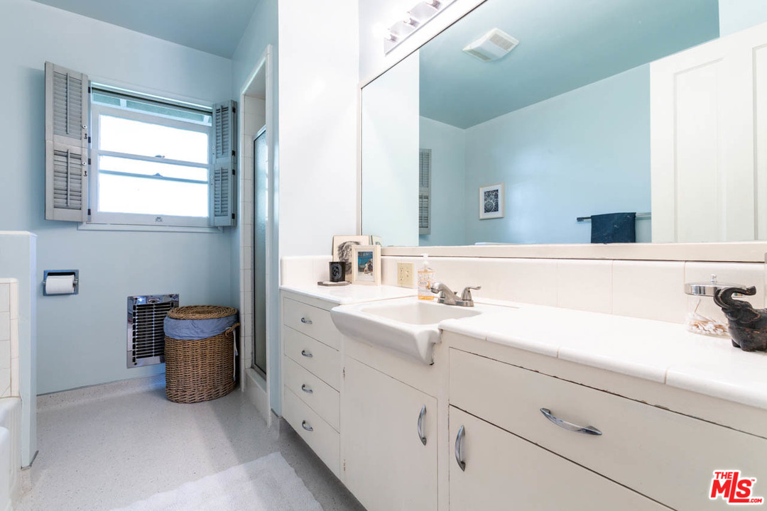988 West Avenue 37 Los Angeles, CA 90065 - Photo 22 of 53 a bathroom with a sink double vanity and a mirror