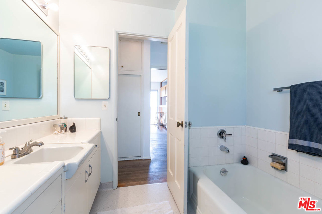 988 West Avenue 37 Los Angeles, CA 90065 - Photo 24 of 53 a bathroom with a tub sink and mirror