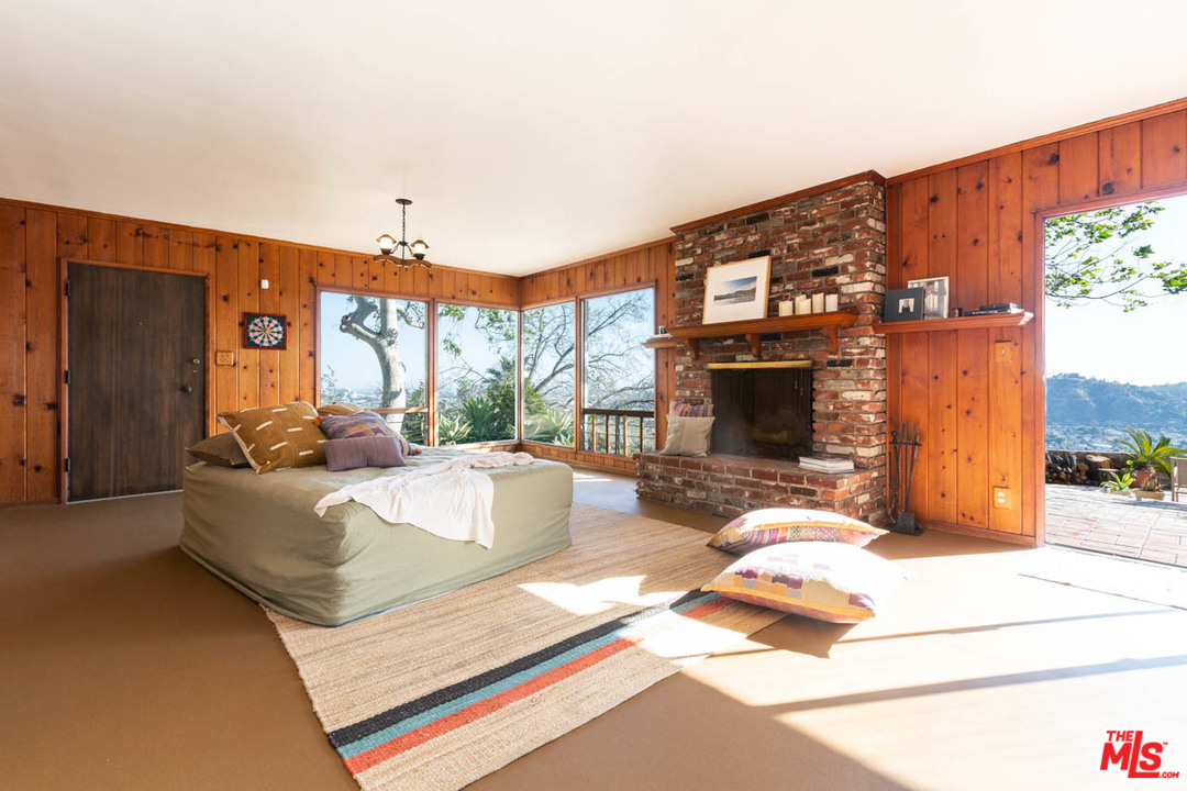 988 West Avenue 37 Los Angeles, CA 90065 - Photo 34 of 53 a living room with furniture a fireplace and a flat screen tv