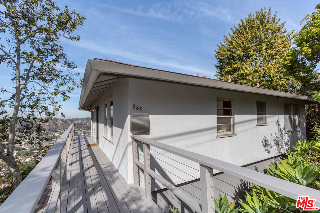 988 West Avenue 37 Los Angeles, CA 90065 - Photo 4 of 53 a balcony with table and chairs