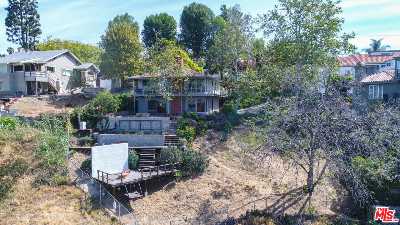 988 West Avenue 37 Los Angeles, CA 90065 - Photo 50 of 53 a front view of a house with garden and plants