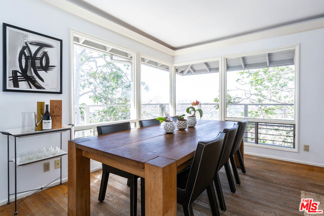 988 West Avenue 37 Los Angeles, CA 90065 - Photo 10 of 53 a view of a dining room with furniture and wooden floor