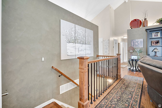 2139 Village Point Way Sandy, UT 84093 - Photo 19 of 35 Staircase with updated wood handrail and black metal balusters.