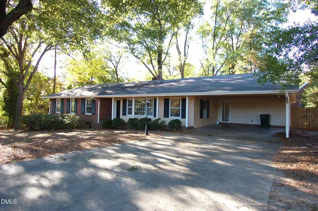 a front view of a house with yard