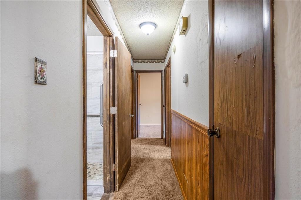 12379 Chapman Road Tyler, TX 75708 - Photo 18 of 40 a view of a hallway with wooden floor