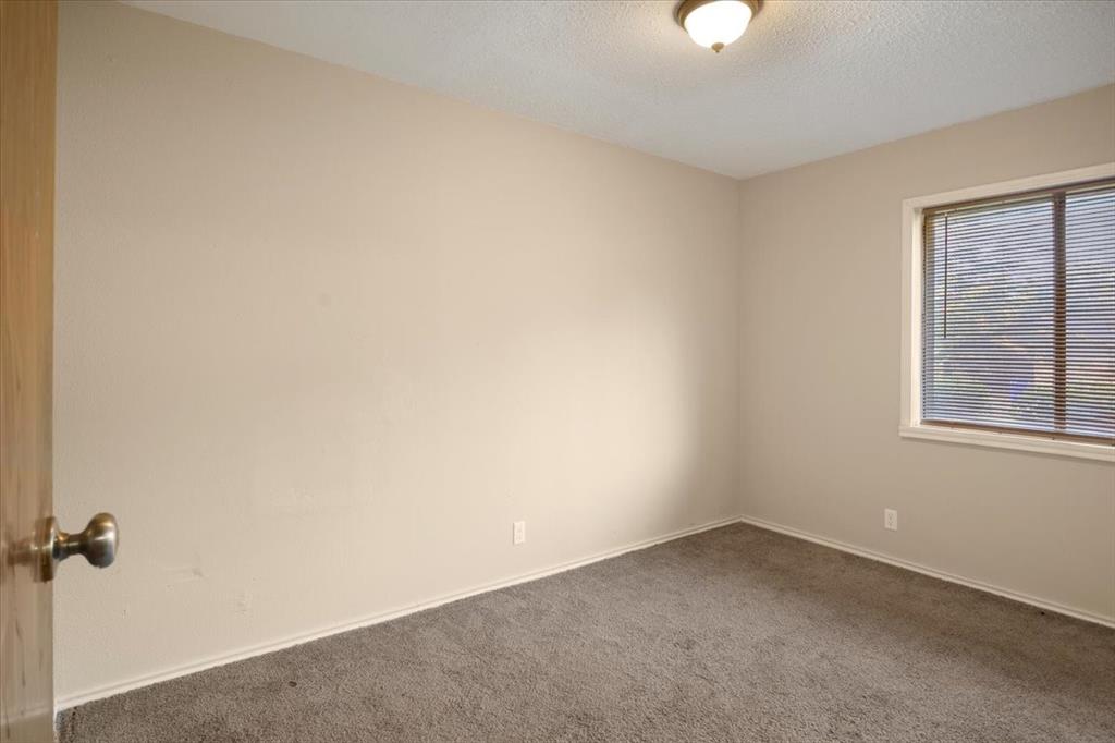 12379 Chapman Road Tyler, TX 75708 - Photo 21 of 40 an empty room with a window