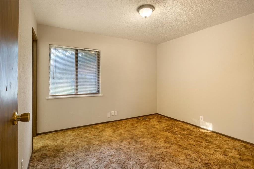 12379 Chapman Road Tyler, TX 75708 - Photo 25 of 40 an empty room with a workbench