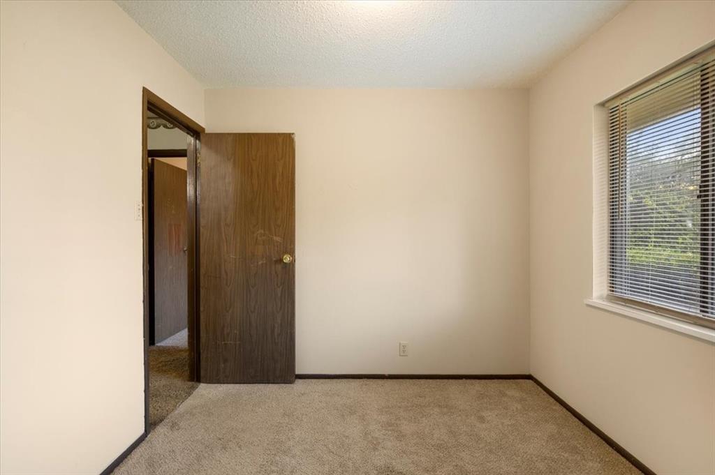 12379 Chapman Road Tyler, TX 75708 - Photo 26 of 40 an empty room with windows and closet