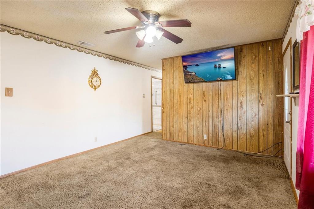 12379 Chapman Road Tyler, TX 75708 - Photo 3 of 40 a view of a livingroom with a fan