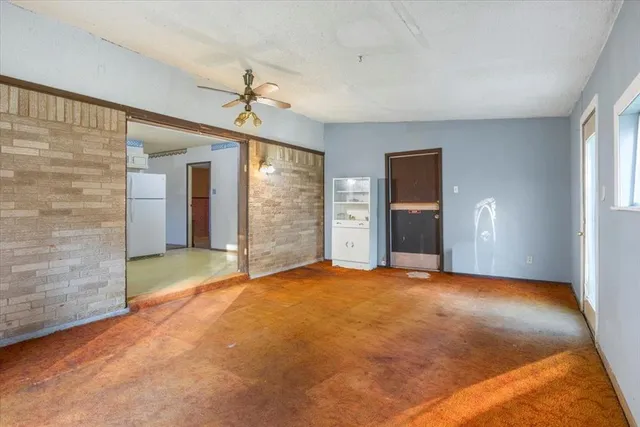 an empty room with windows and outdoor view