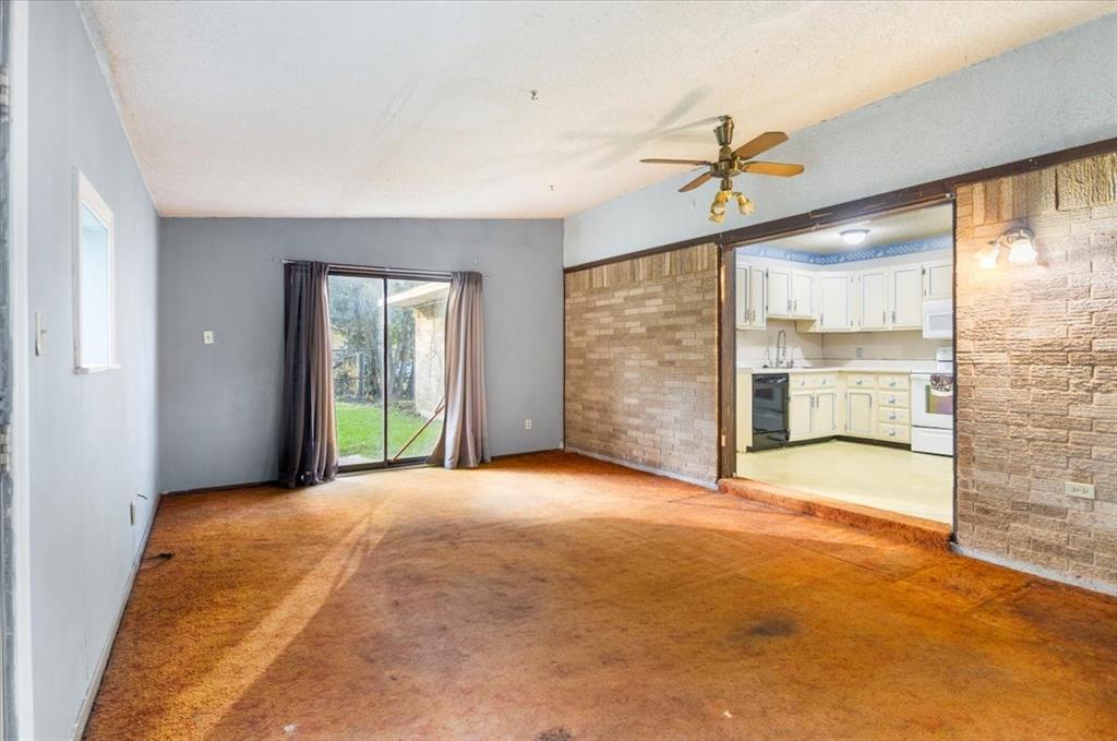 12379 Chapman Road Tyler, TX 75708 - Photo 32 of 40 an empty room with windows and outdoor view