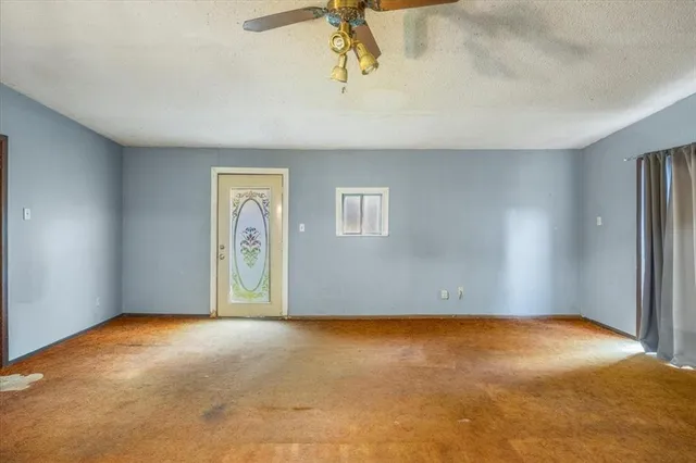 a view of a yard with large trees