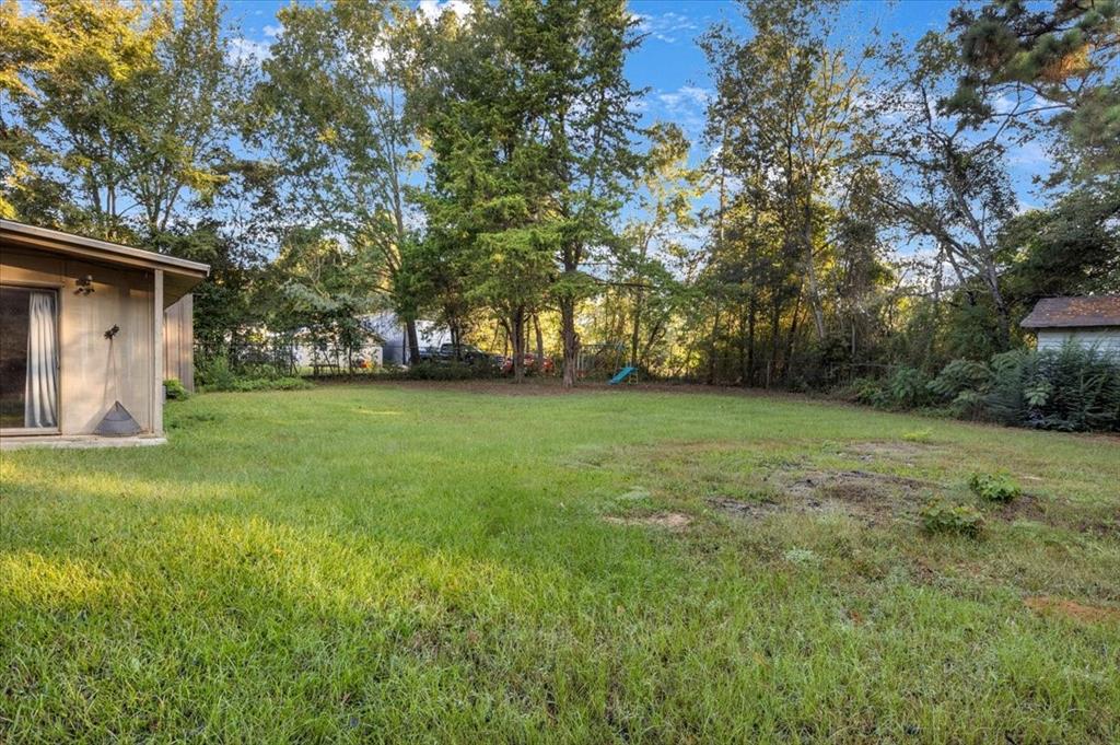 12379 Chapman Road Tyler, TX 75708 - Photo 35 of 40 a view of a yard with large trees