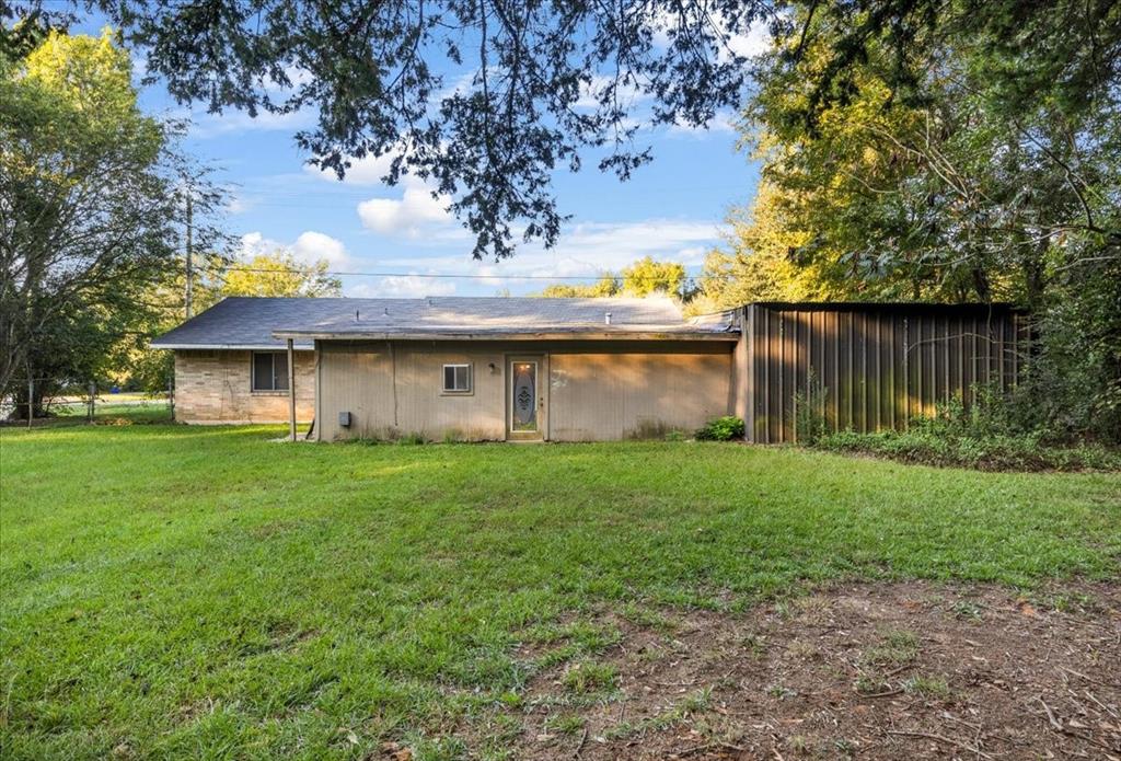 12379 Chapman Road Tyler, TX 75708 - Photo 37 of 40 a view of a house with a yard