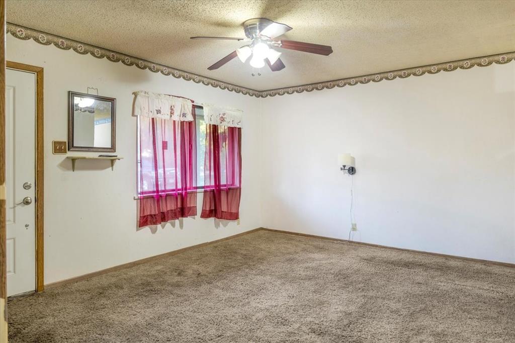 12379 Chapman Road Tyler, TX 75708 - Photo 4 of 40 a view of a room with window and ceiling fan