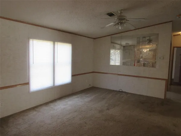 an empty room with a empty space and windows
