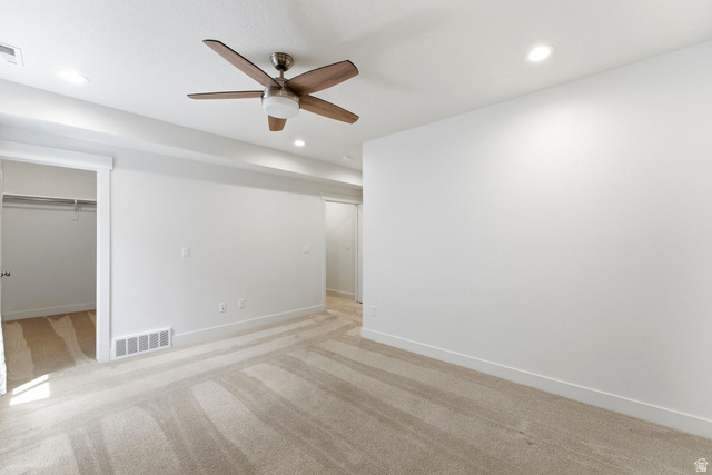 108 West Monte Rosa Lane Midway, UT 84049 - Photo 29 of 48 Spacious room featuring neutral carpeting, a ceiling fan with integrated lighting, and recessed ceiling lights