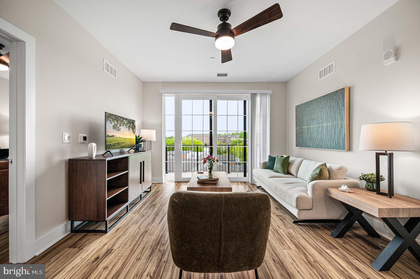 703 Rice Boulevard, Unit 103 Exton, PA 19341 - Photo 4 of 10 Bright and airy living space awaits.