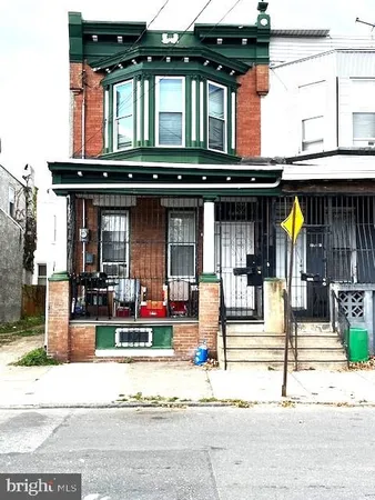 a front view of house with small garden