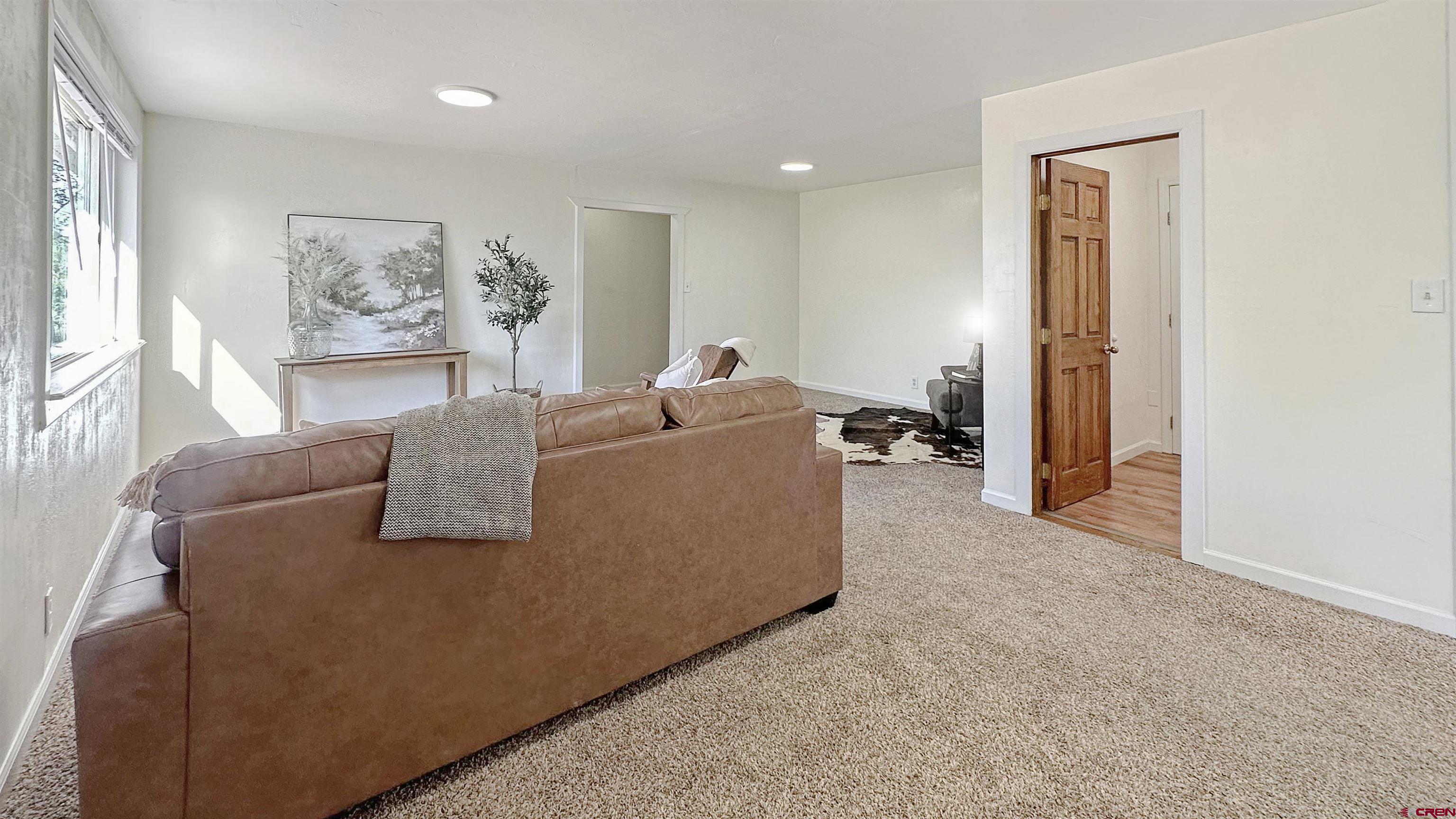 629 Norwood Road Montrose, CO 81403 - Photo 11 of 38 a living room with furniture and a window