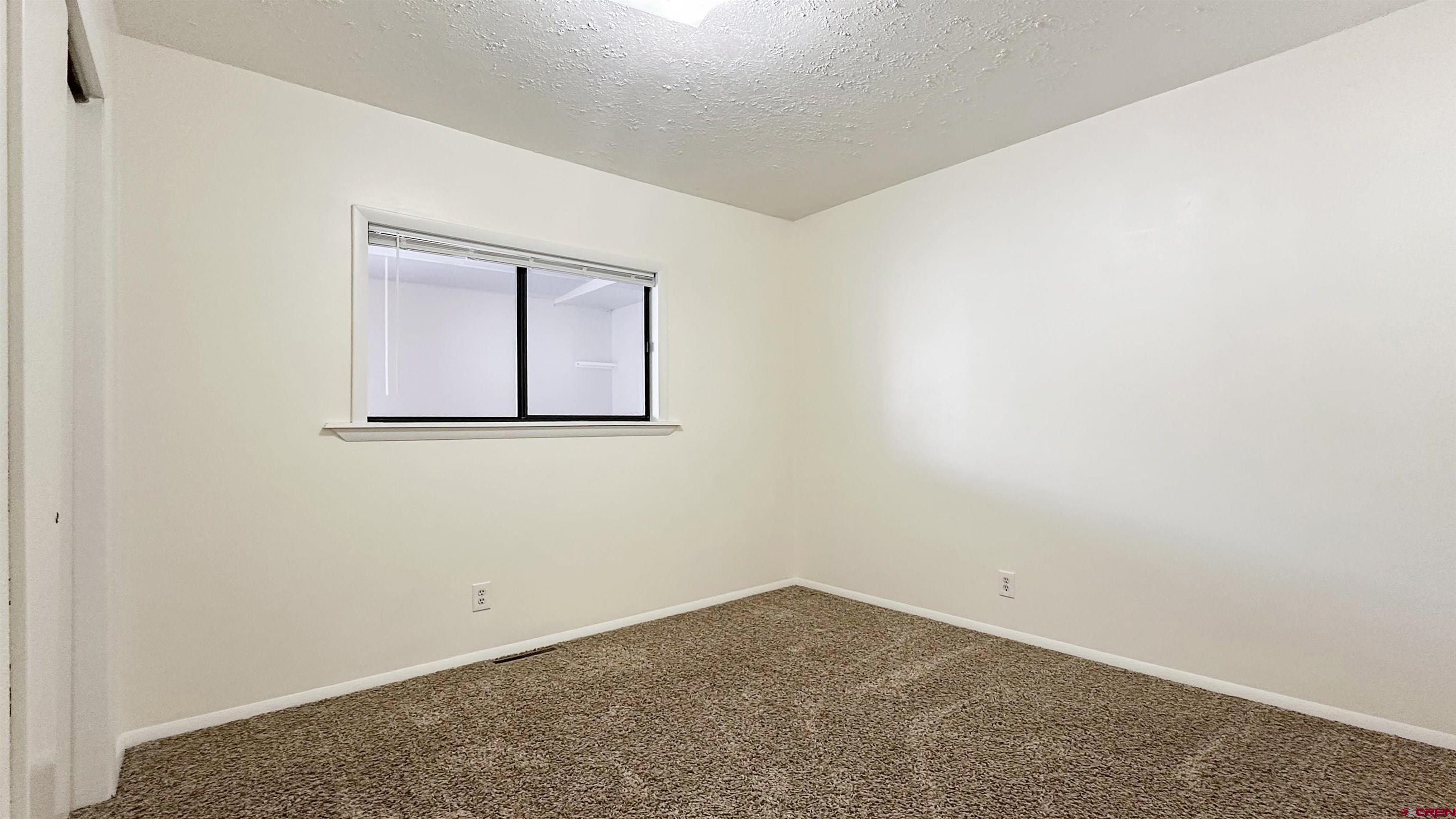 629 Norwood Road Montrose, CO 81403 - Photo 18 of 38 an empty room with a window