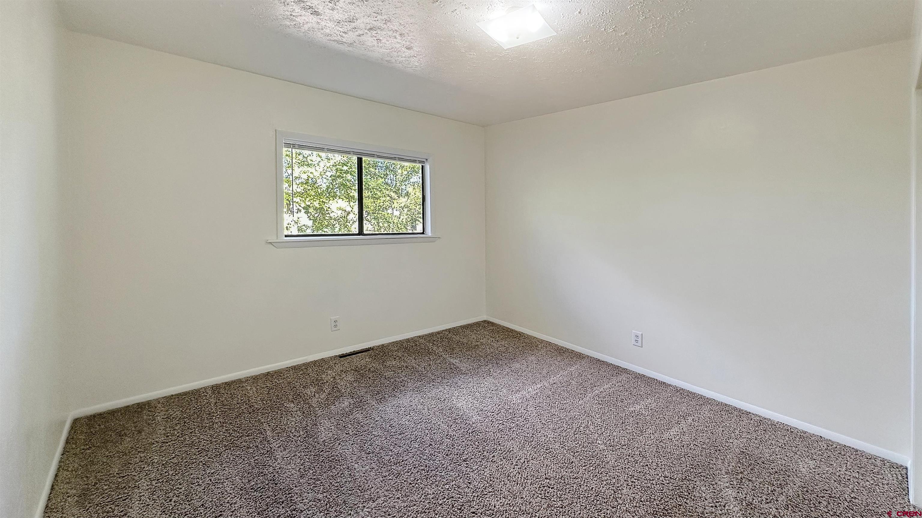 629 Norwood Road Montrose, CO 81403 - Photo 19 of 38 an empty room with a window