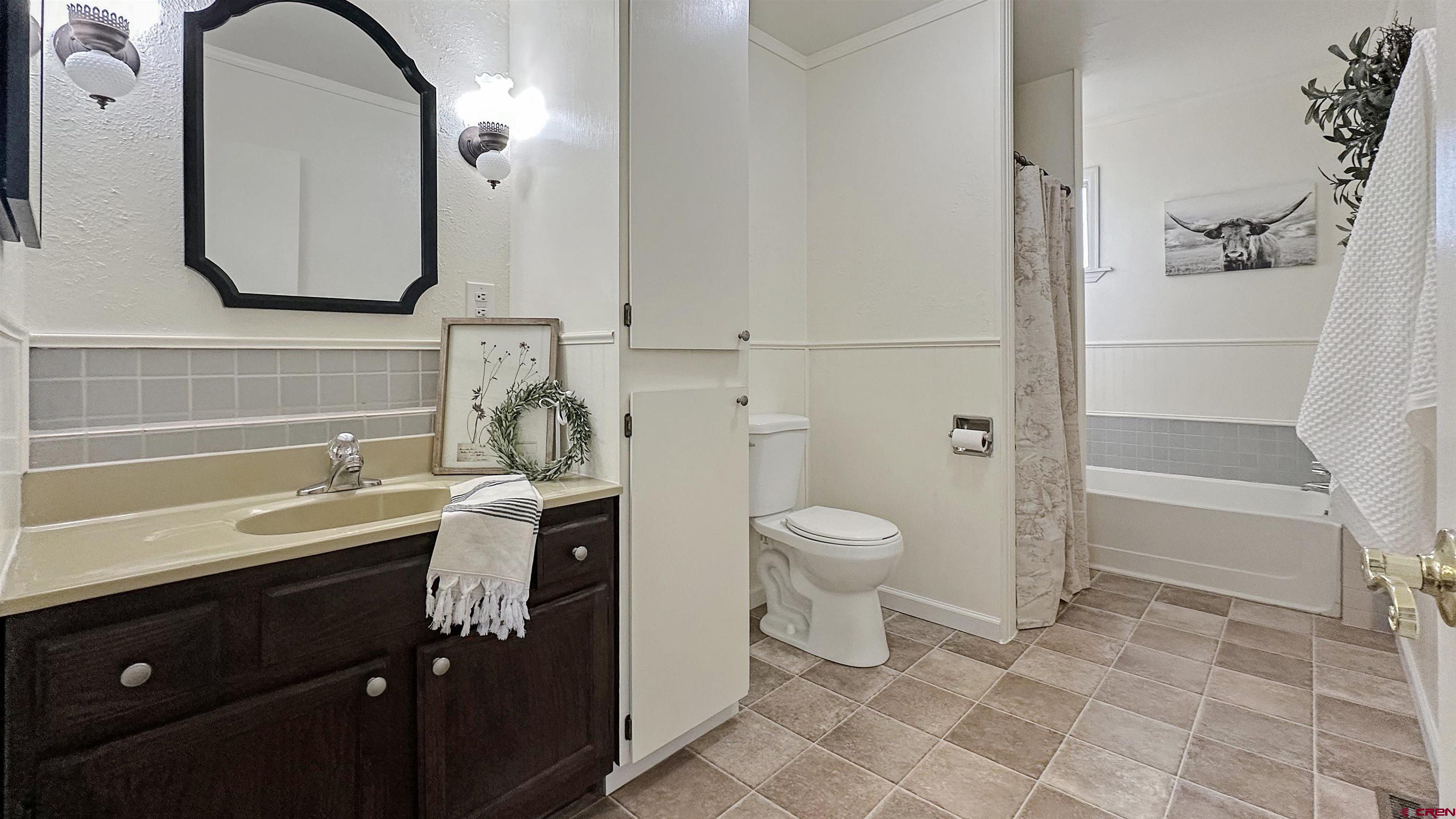 629 Norwood Road Montrose, CO 81403 - Photo 21 of 38 a bathroom with a sink a toilet and shower