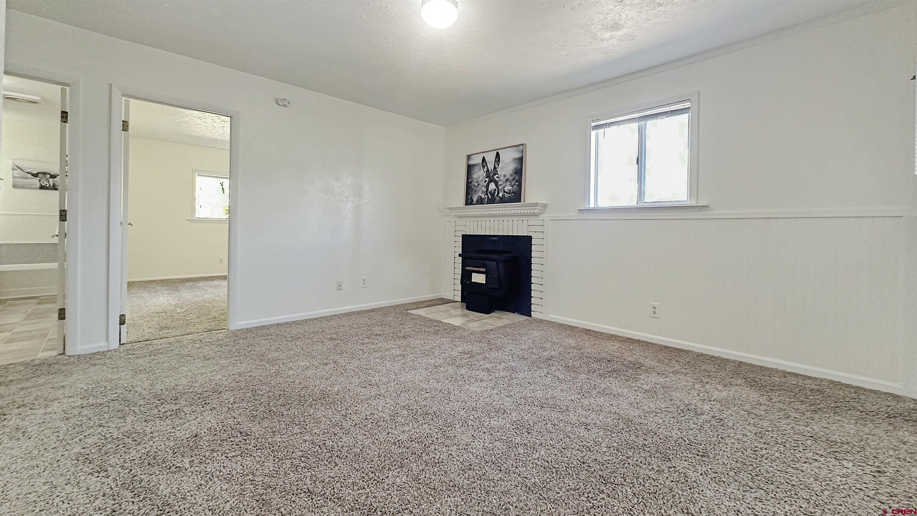 629 Norwood Road Montrose, CO 81403 - Photo 22 of 38 an empty room with windows and closet