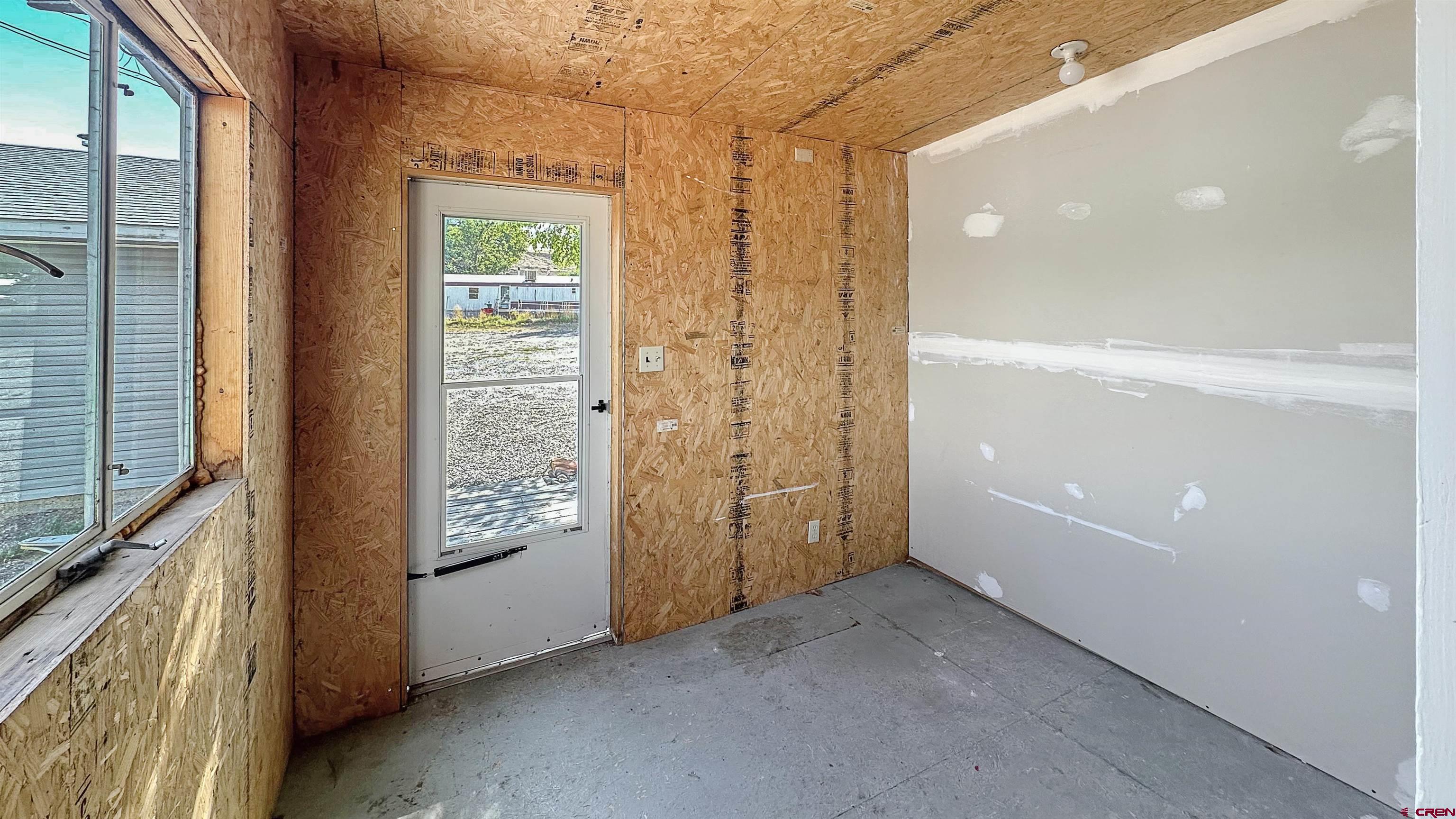 629 Norwood Road Montrose, CO 81403 - Photo 24 of 38 a view of an empty room and a window