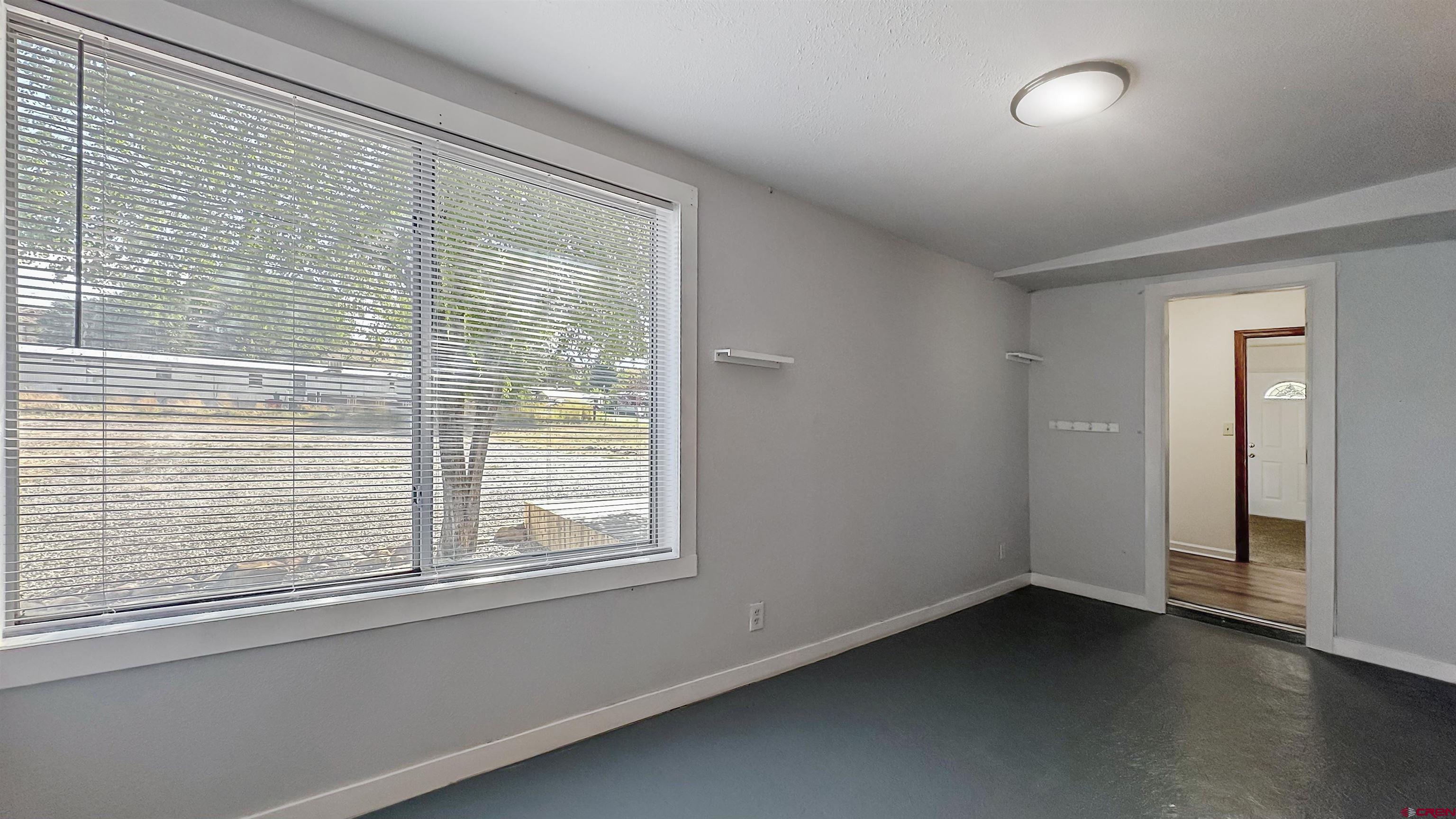 629 Norwood Road Montrose, CO 81403 - Photo 26 of 38 a view of an empty room with a window
