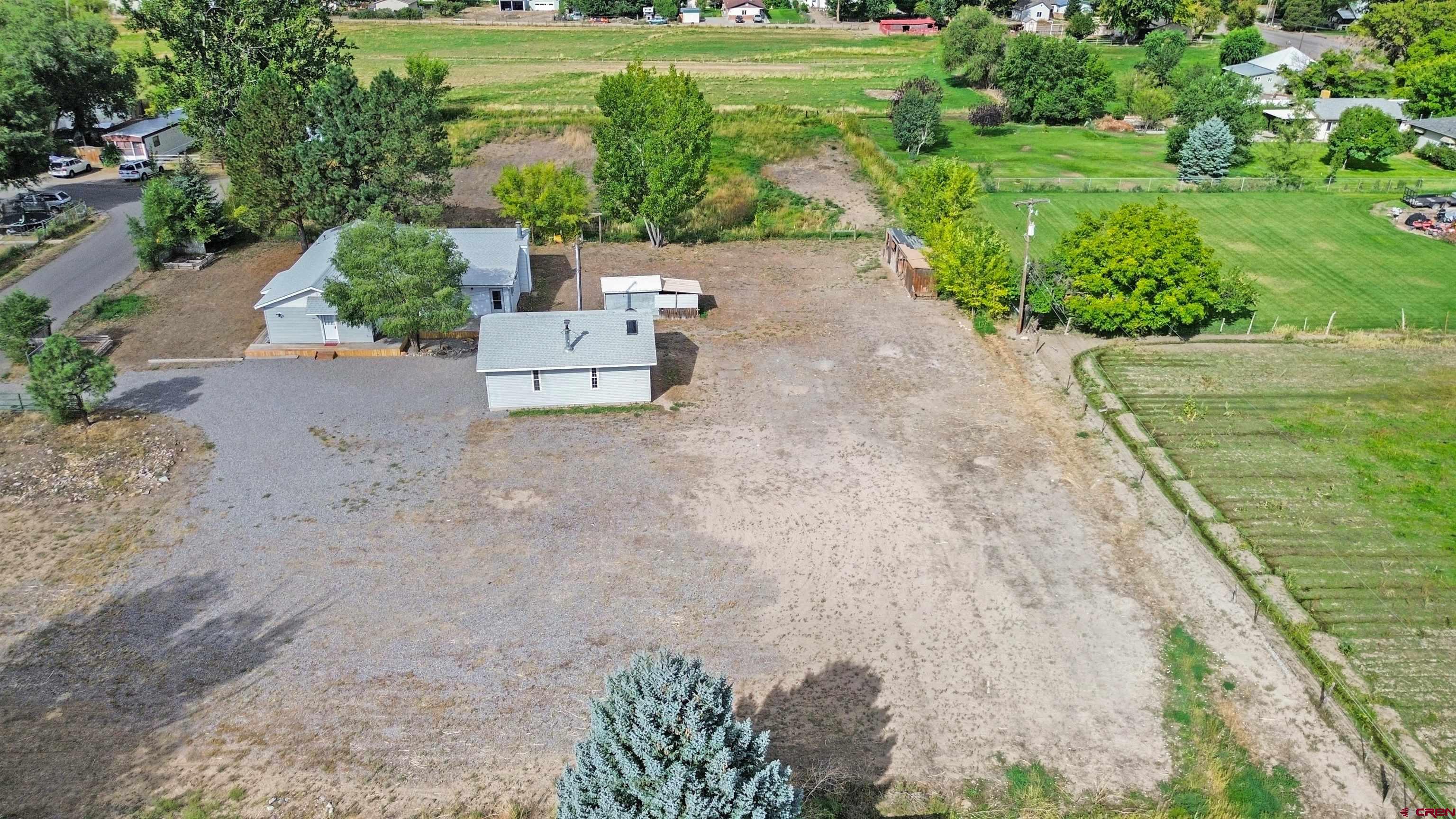 629 Norwood Road Montrose, CO 81403 - Photo 32 of 38 a view of a garden with a bench