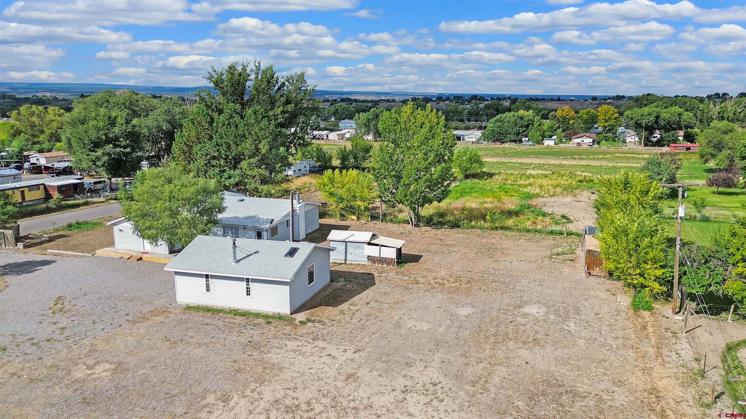 629 Norwood Road Montrose, CO 81403 - Photo 33 of 38 a view of a garden with an outdoor seating