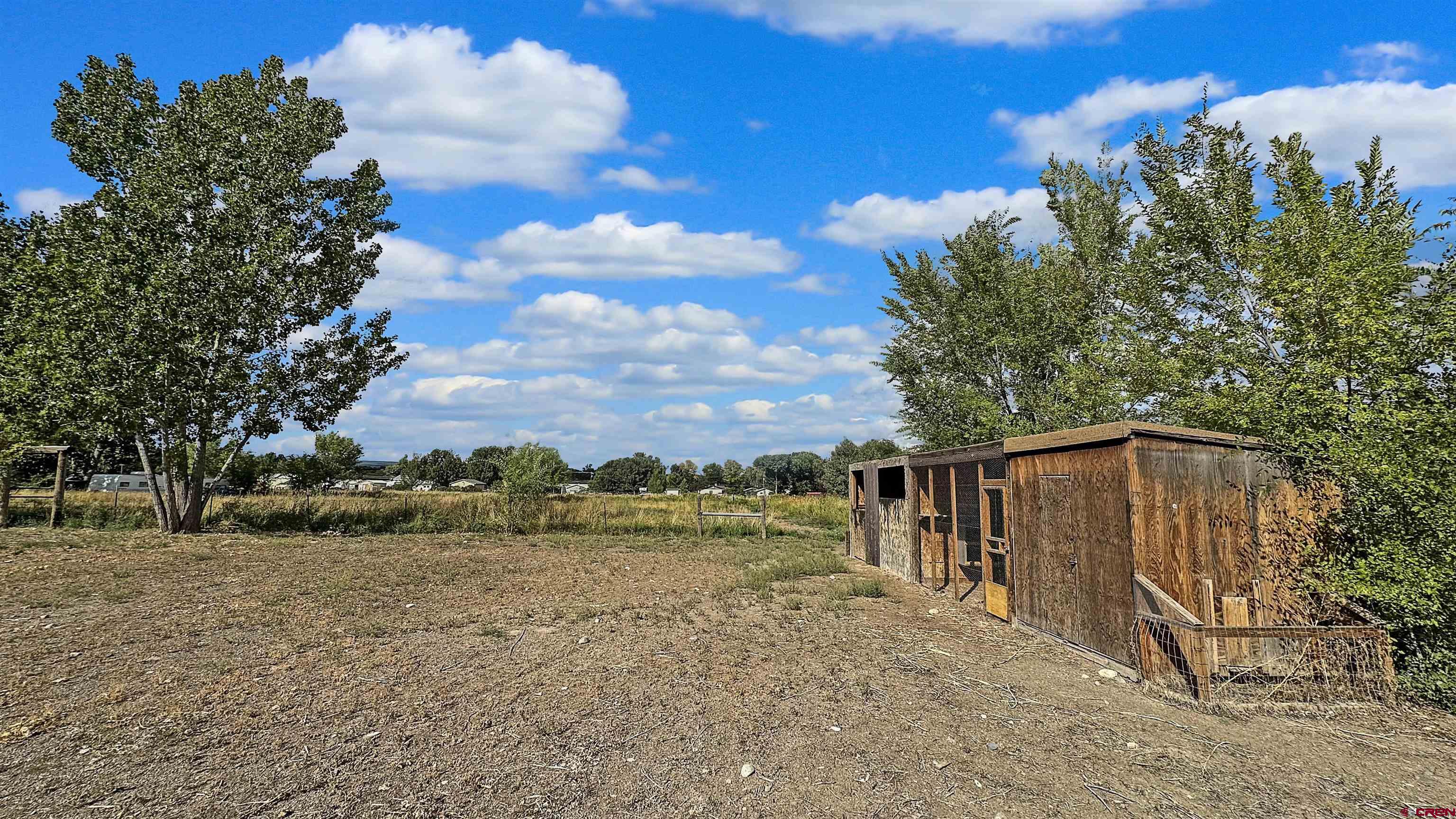 629 Norwood Road Montrose, CO 81403 - Photo 36 of 38 a view of a house with a yard